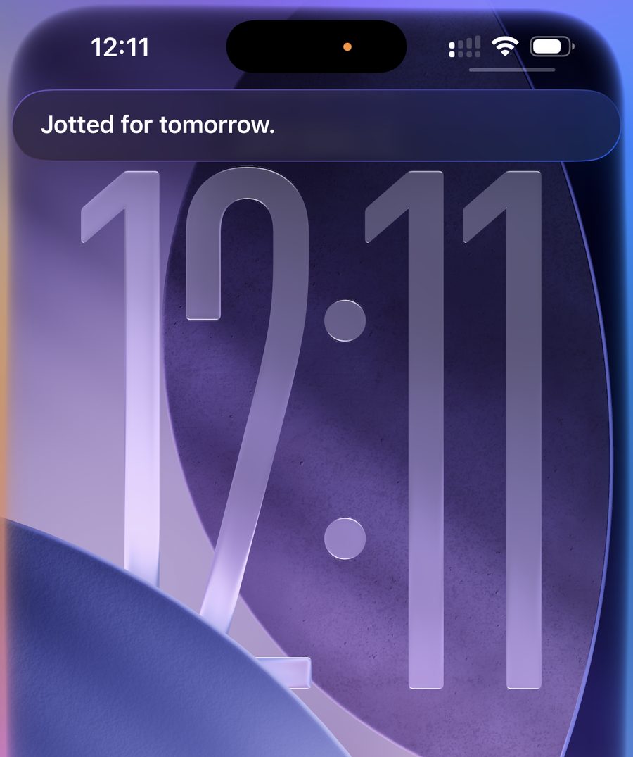 iPhone lock screen with Siri saying Jotted for tomorrow